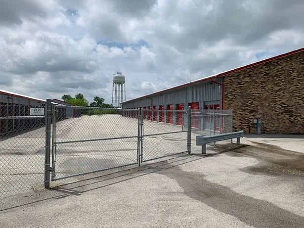 Secure gated entry leading into drive-up storage unit courtyard